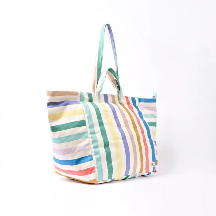 side view of Multicolored striped tote bag on a white background