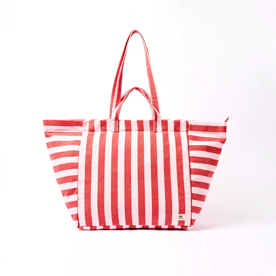 Red and pink striped tote bag on a white background