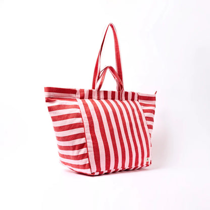Red and pink striped tote bag on a white background