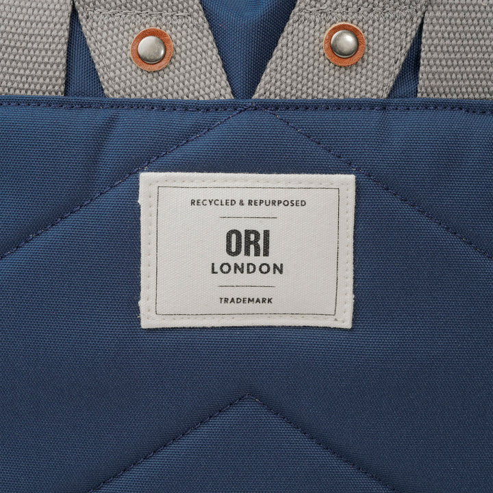 close-up of Ori London patch on back of Richmond backpack.