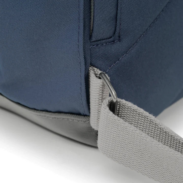 close-up of shoulder strap attached to backpack.