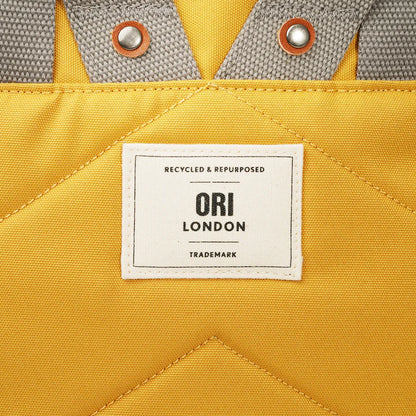 close-up of Ori London patch on back of Richmond backpack.