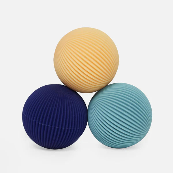 spek odds lines silicone balls in yellow and blues stacked on top of each other