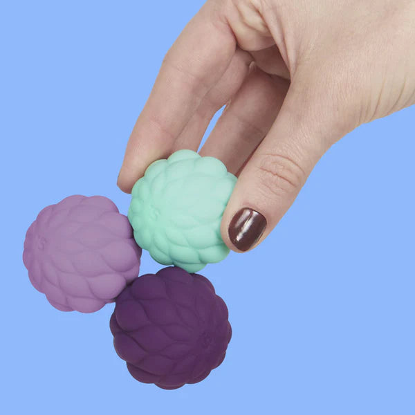 hand holding the odds puffs silicone balls