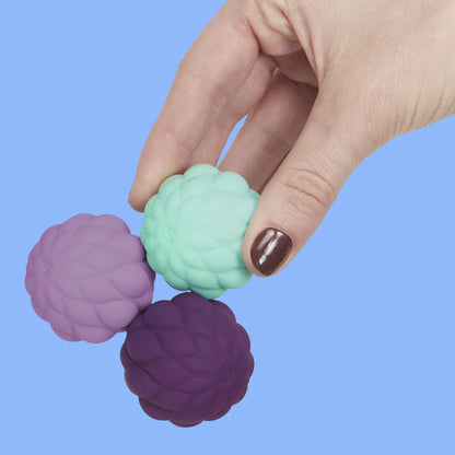 hand holding the odds puffs silicone balls