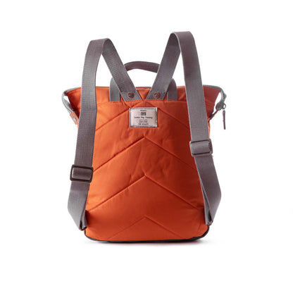 back view of orange bantry b backpack showing shoulder straps.