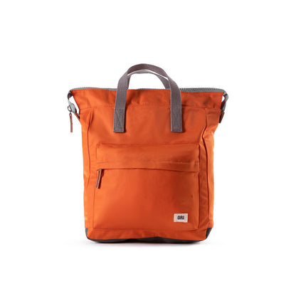 front view of orange bantry b backpack.