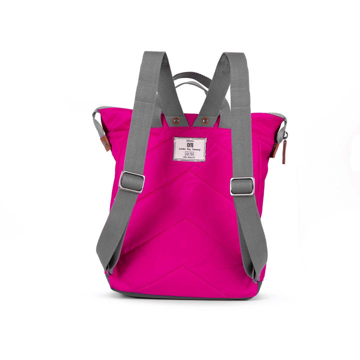 back view of pink bantry b backpack showing shoulder straps.