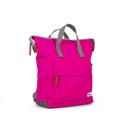 side view of pink bantry b backpack.