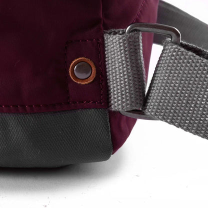 close of plum bantry b backpack's strap attachments.