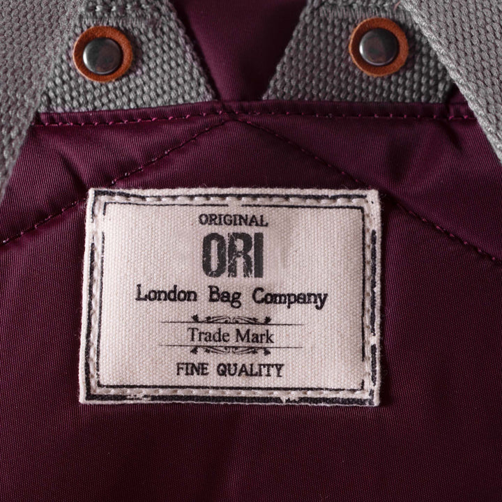 close of plum bantry b backpack's ori logo tag.