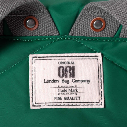 close of emerald canfield b backpack's ori logo tag.