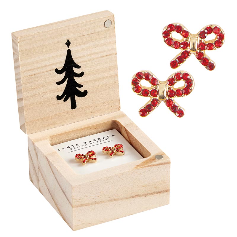 wood box pair of red bow earrings in it and another pair of bow earrings displayed next to it.