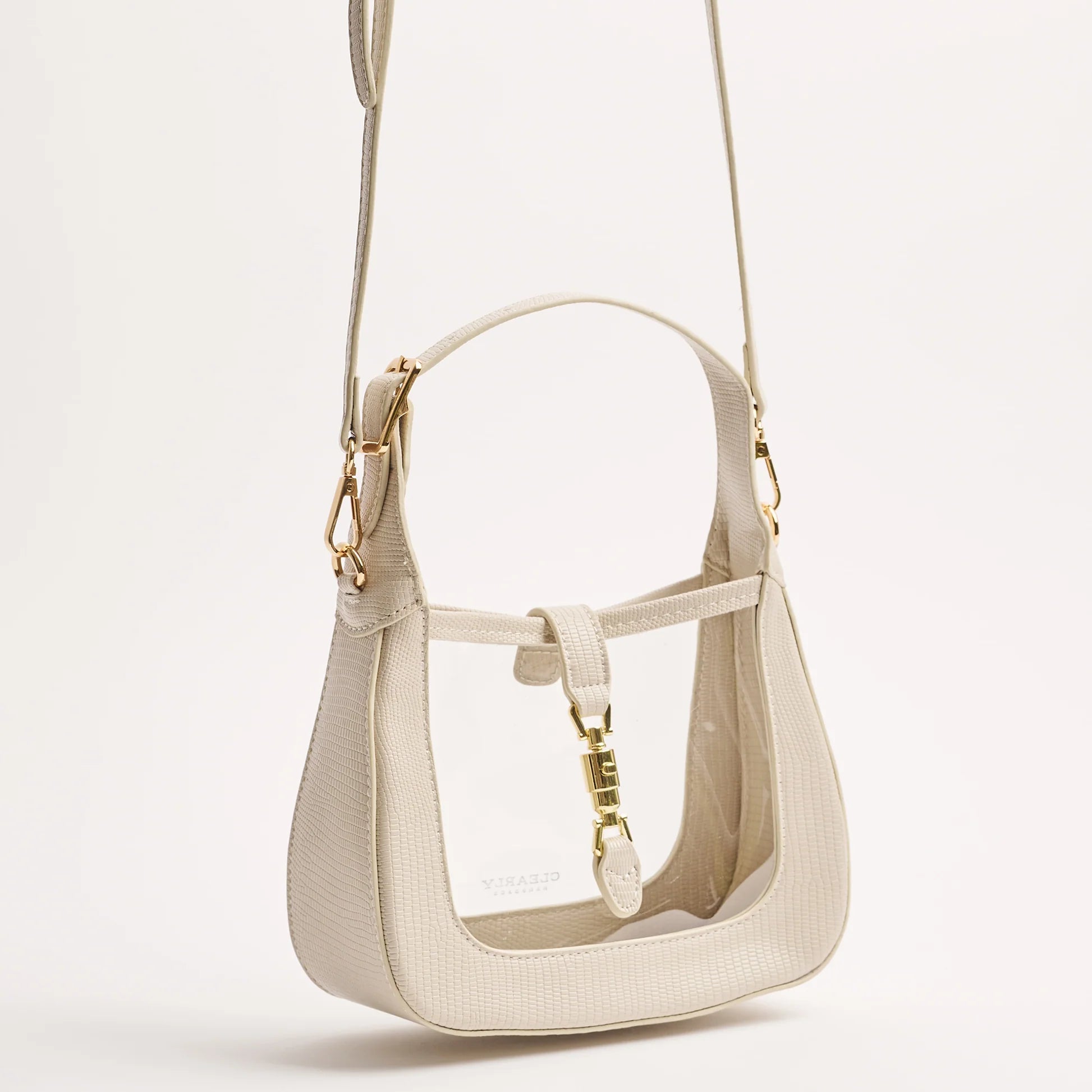 angled view of paige in ivory hanging from the long strap