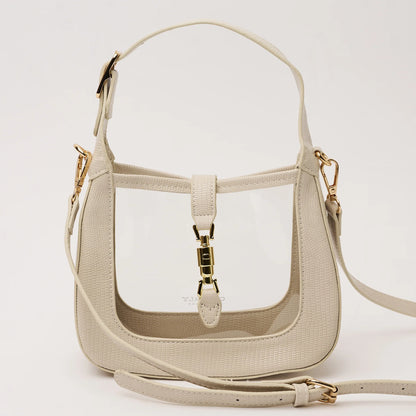 clear handbag with ivory trim and short strap and and longer cross body strap and gold hardware