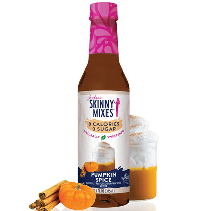 syrup bottle displayed with a cold drink and a pumpkin and cinnamon sticks