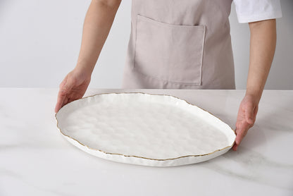 hands holding Portofino Large Oval Platter.