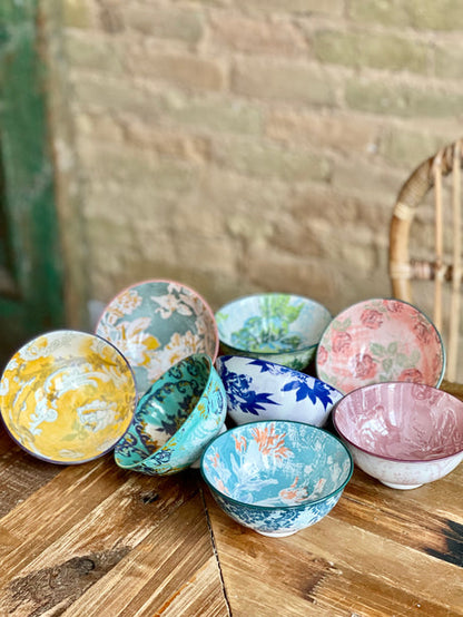 collection of 8 assorted colorful bowls on a table.