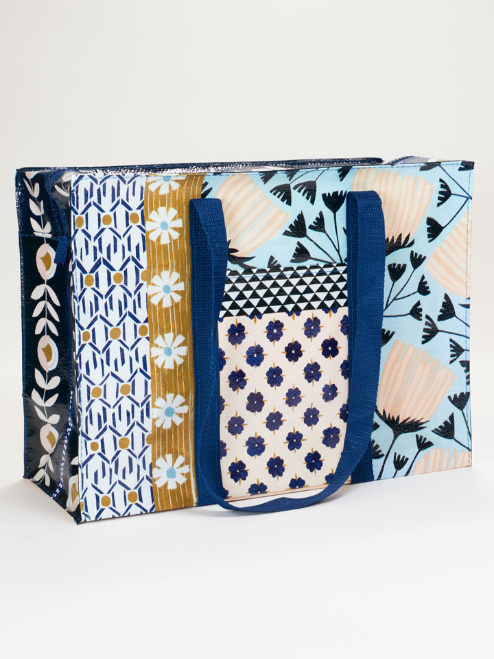 front view of Patchwork Shoulder Tote printed with patterns in blues and pinks and mustard
