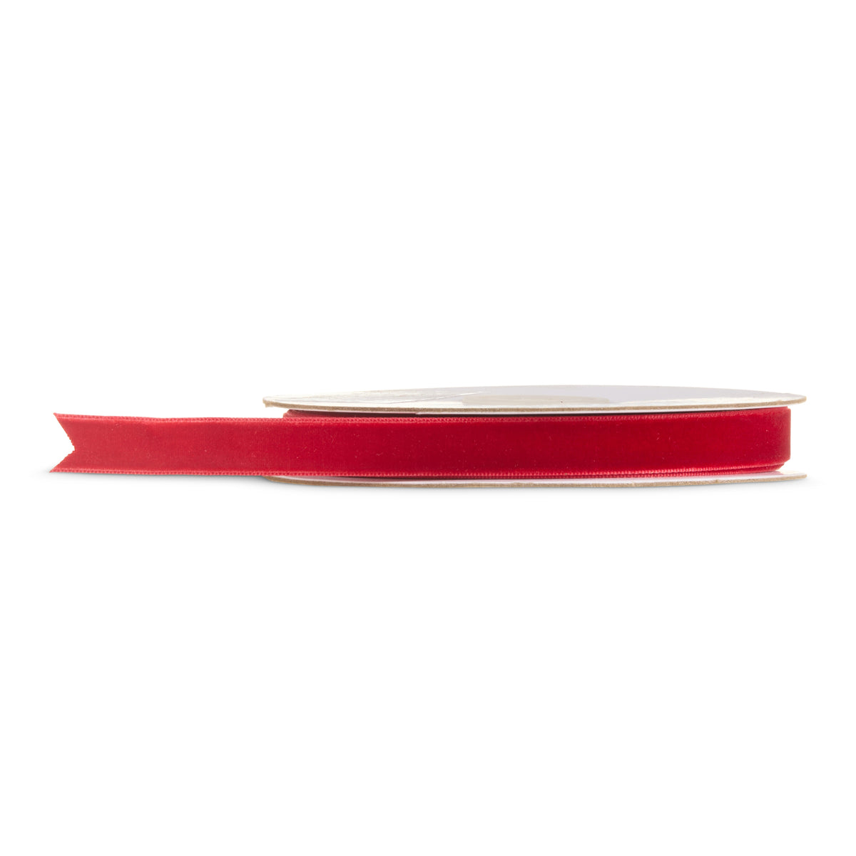 Red velvet ribbon spool against a white background