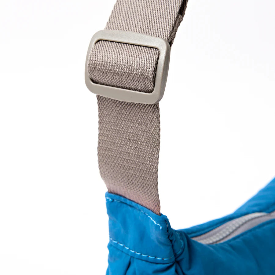close-up of grey strap on blue bag