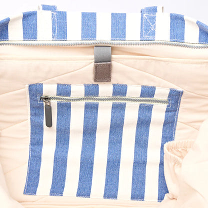 interior view of Blue and white striped tote bag showing zipper pocket and laptop sleeve