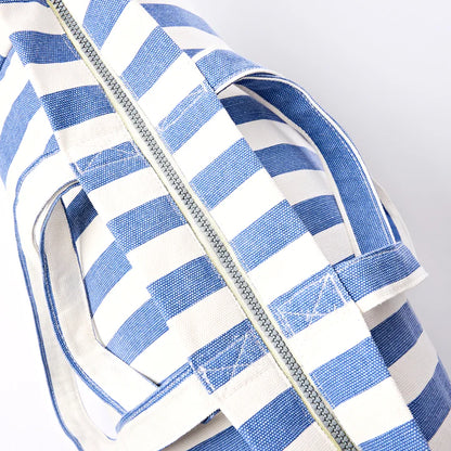 top view of Blue and white striped tote bag showing zipper closure