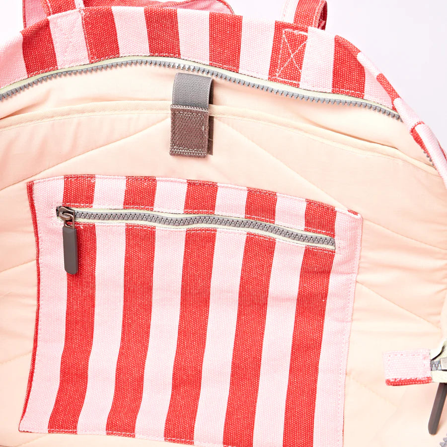 Close-up of interior of tote bag showing zippered pocket and laptop sleeve
