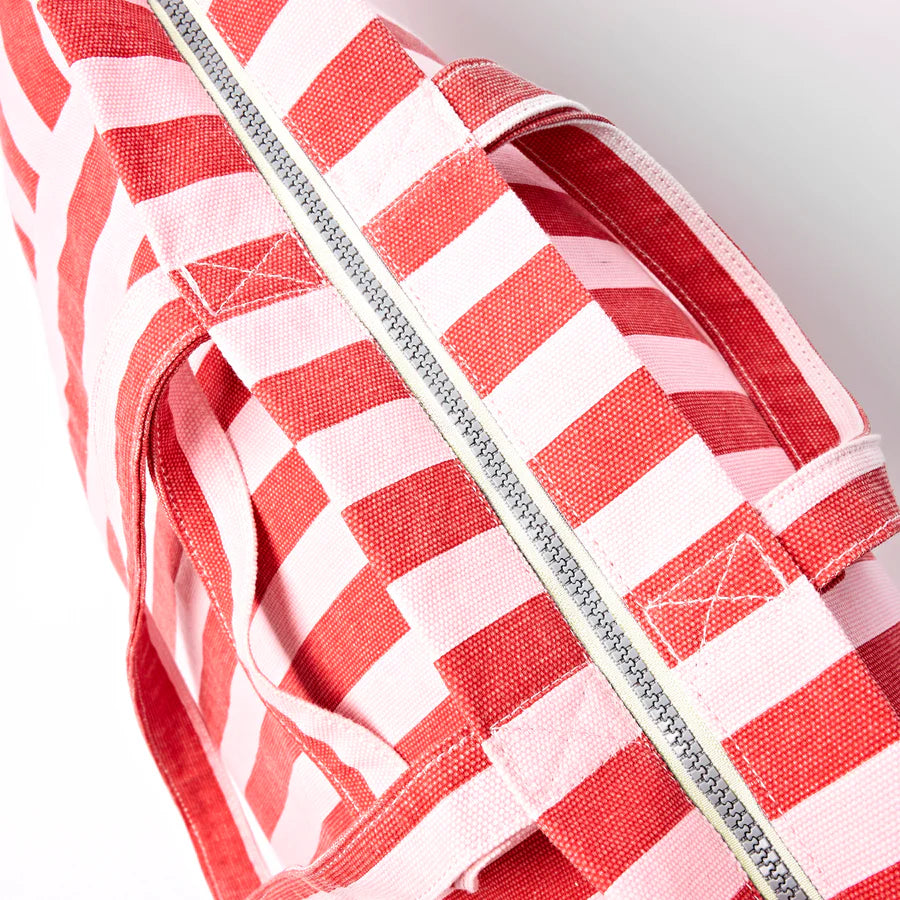 top view of red and pink tote bag showing zipper closure