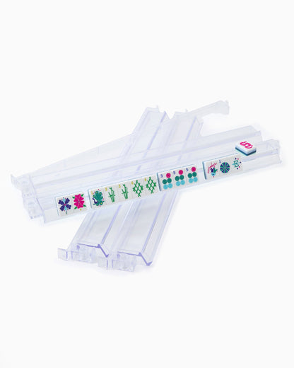 clear acrylic rack and pusher set with mahjong tiles on it