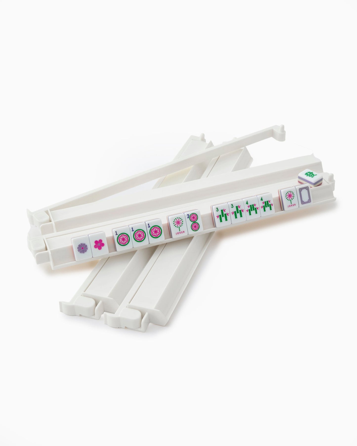 white acrylic rack and pusher sets with mahjong tiles on it