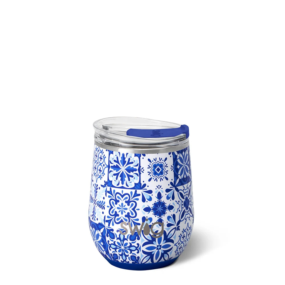 Blue and white patterned tumbler with a lid on a white background