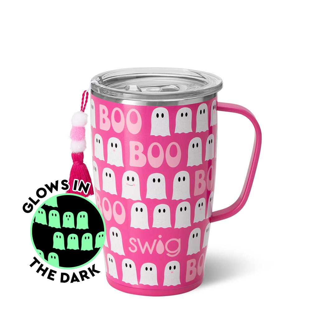 hot pink mug with pattern of white ghost and "boo" on it with an inset picture of the pattern glowing in the dark.