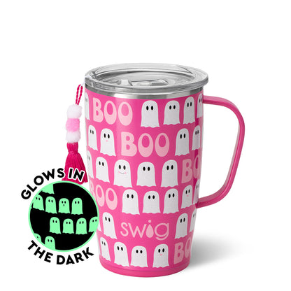 hot pink mug with pattern of white ghost and "boo" on it with an inset picture of the pattern glowing in the dark.