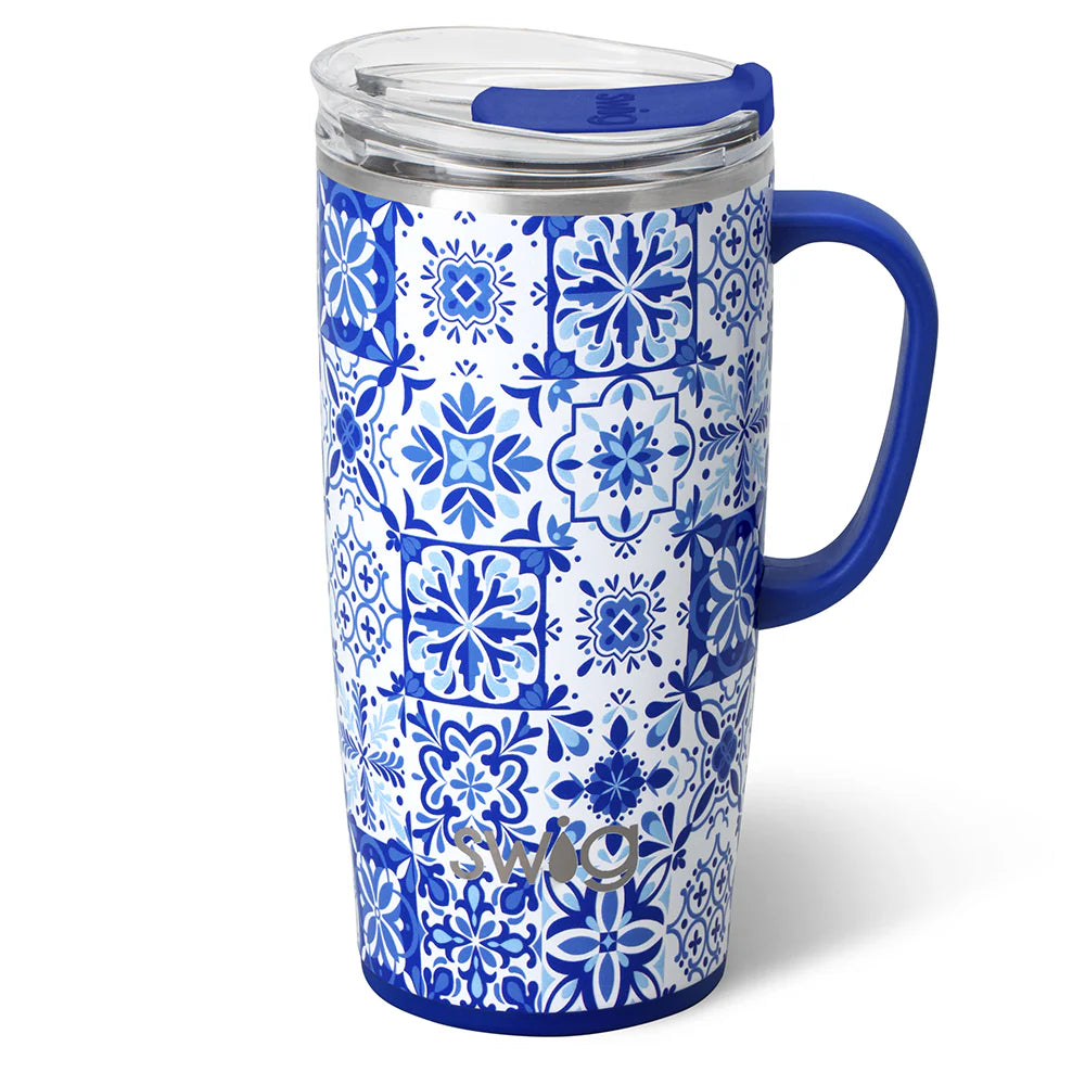 Blue and white patterned insolated mug with a handle and lid on a white background