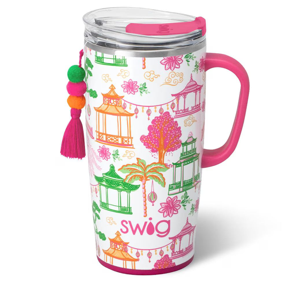 white tumbler with pink handle and pink and green pagoda design