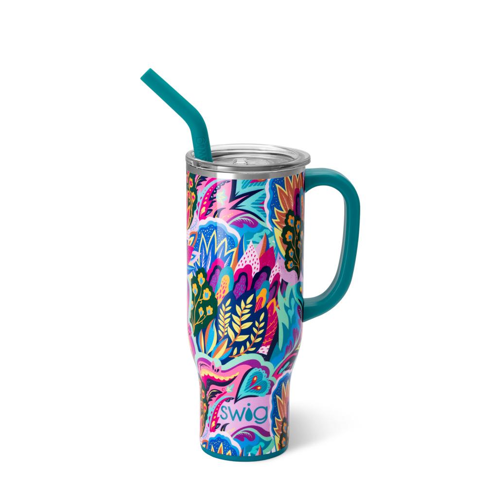 tumbler with teal handle and straw and brightly colored floral patterned body.