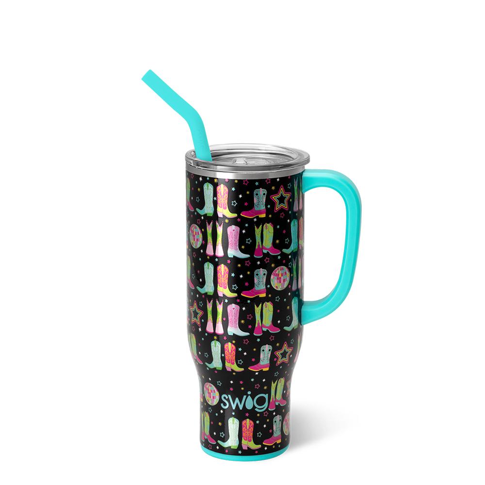 black tumbler with pattern of boots and stars in pinks, greens and blue and aqua handle and straw.