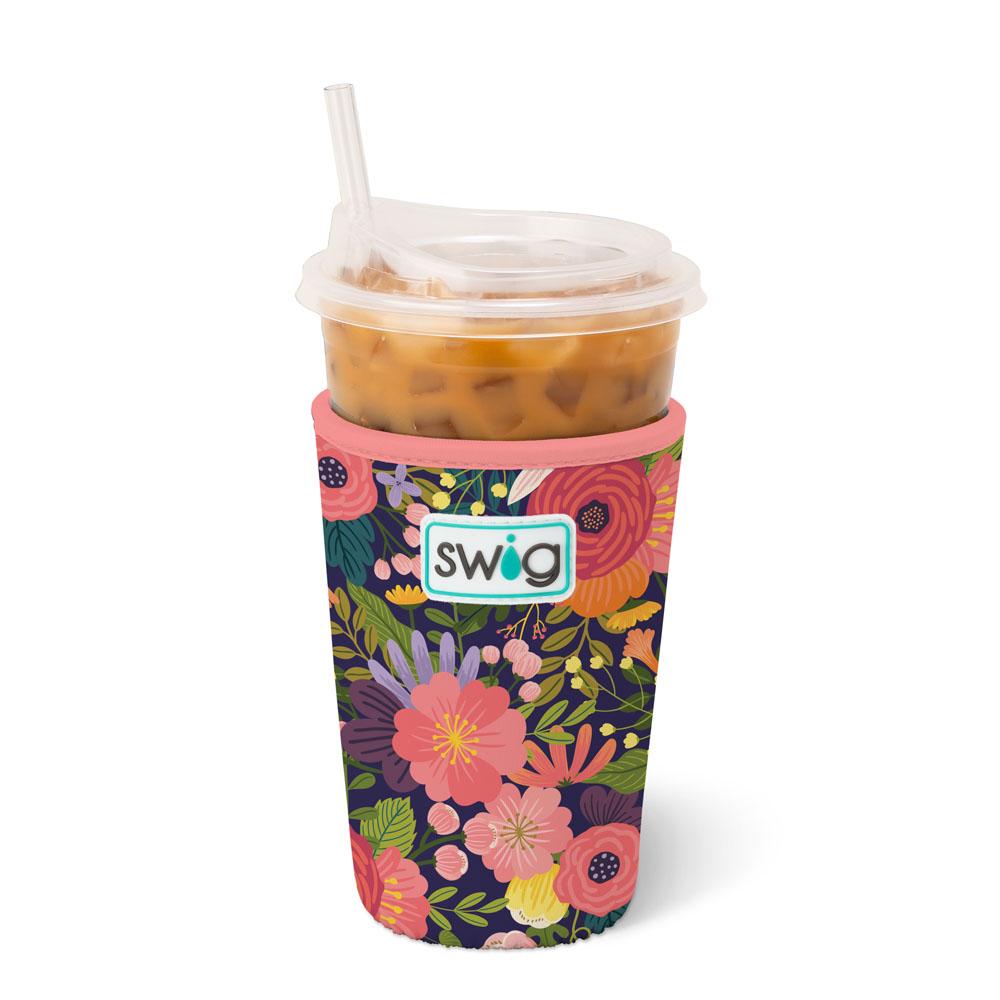 blush, navy, coral colored iced cup coolie with an iced coffee in the coolie