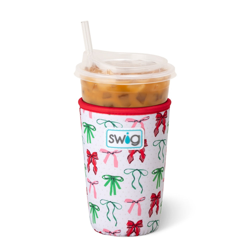 white coolie with colorful bows printed on it on an iced beverage.