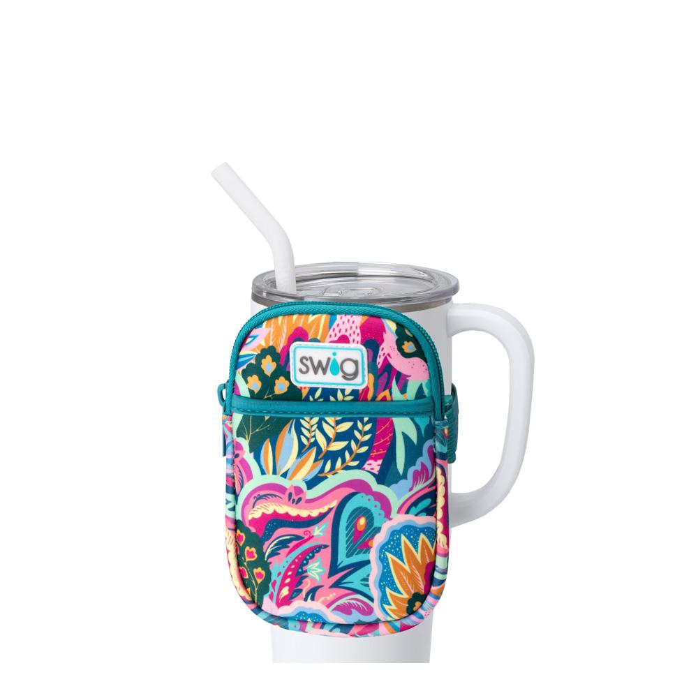 colorful floral patterned pouch on a white tumbler.