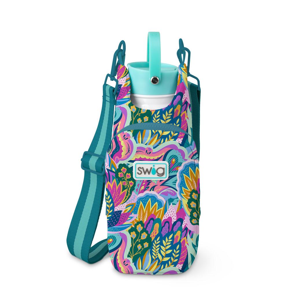 brightly colored floral patterned sling bag with front pocket and teal striped strap.