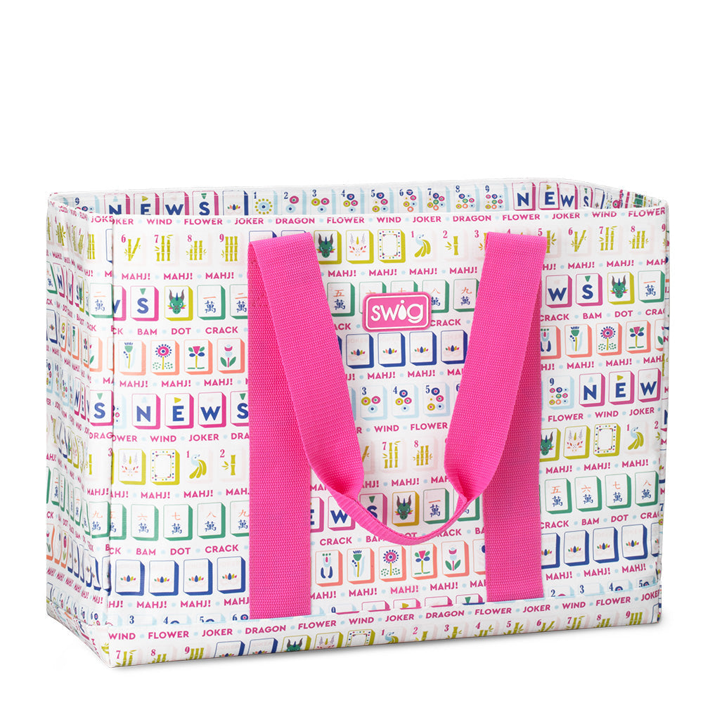 Colorful tote bag with text pattern and pink handles on a white background