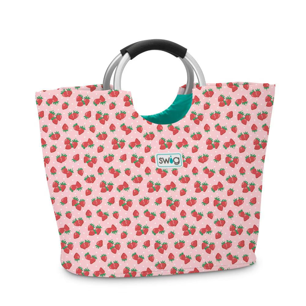 Pink tote bag with ring handles and all over red strawberry design