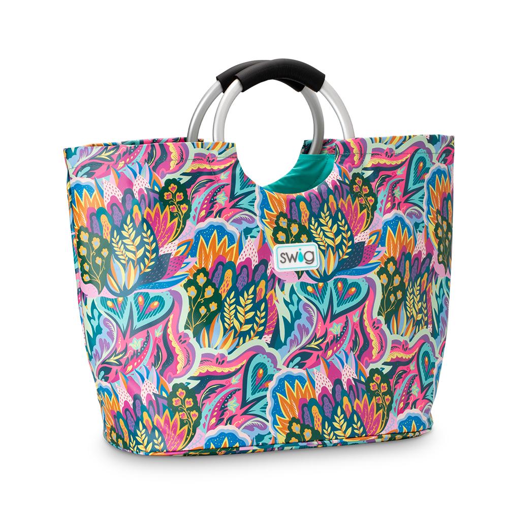 brightly colored tote bag with floral pattern and loop handles.