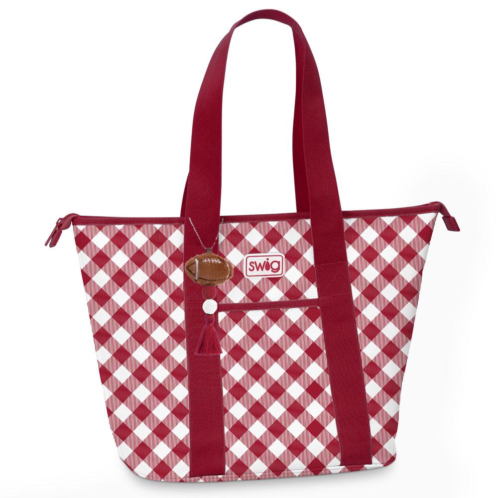 A red and white gingham patterned tote bag with solid red handles, a front pocket, and a small brown football-shaped tag on a white background.