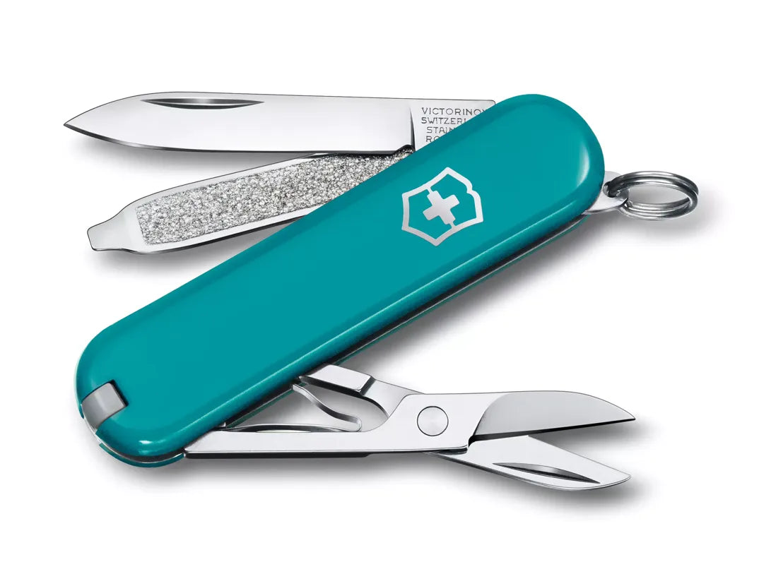 teal Swiss army knife with several tools partially opened