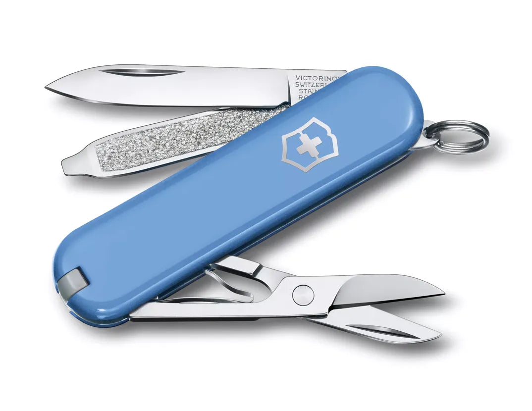 blue Swiss army knife with several tools partially opened