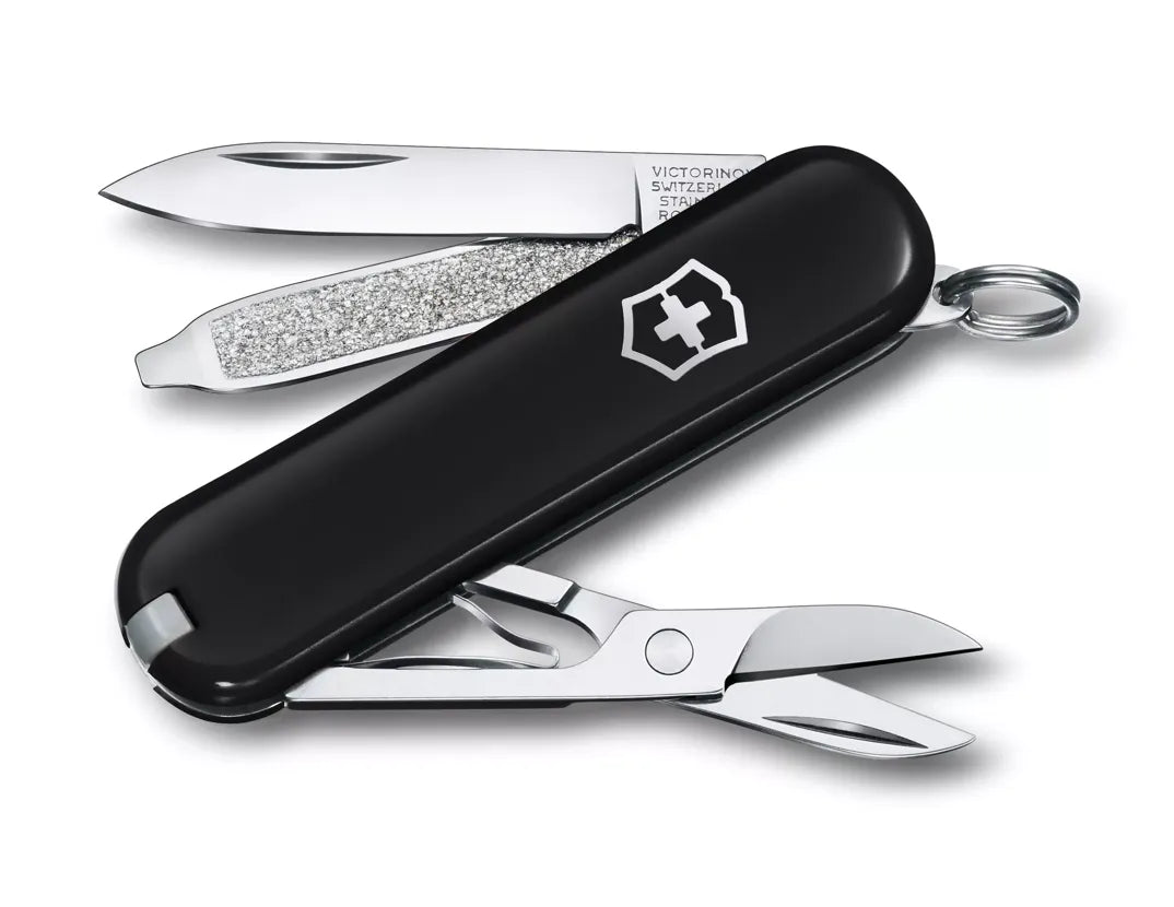 black Swiss army knife with several tools partially opened