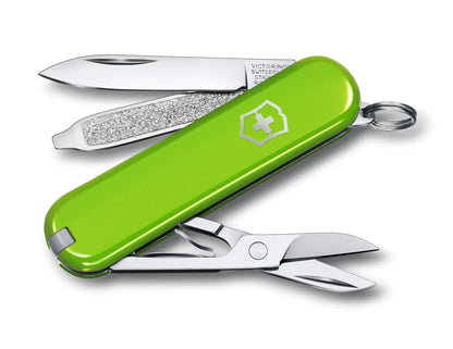 lime green Swiss army knife with several tools partially opened